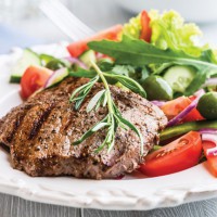 zizzling steak and salad