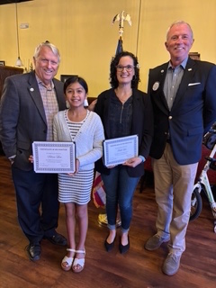 Apopka Mayor Bryan Nelson, essay contest winner Selena Lim, flag redesign contest winner Faith Lee and Foliage Sertoma Club vice president Eric Mock