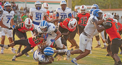 Apopka's Elijah Frazier barrels through a wall of Jones defenders on his way into the end zone on Friday, May 23.