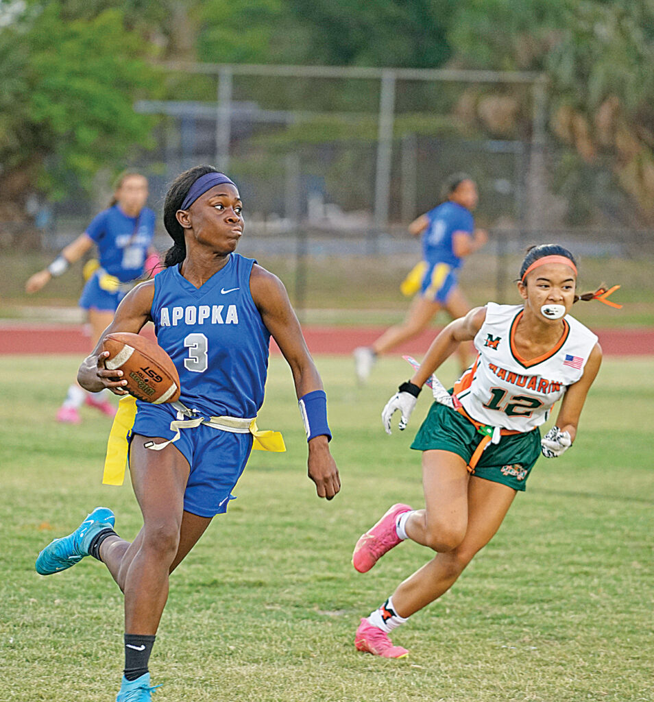 Jhenelle Francis uses her speed to escape the pocket and find a first down in Apopka’s 27-0 win over Mandarin High School in the state tournament.