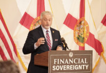 Rep. Doug Bankson speaks at the signing of HB 999.