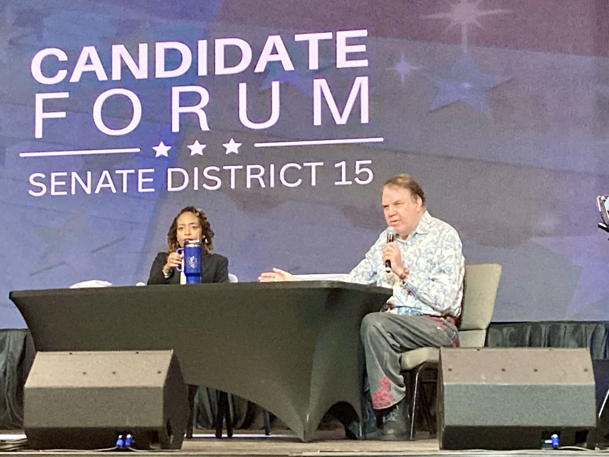 Alan Grayson speaks at the forum.