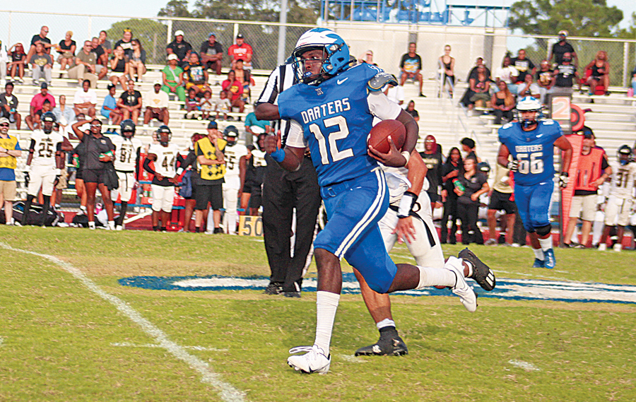 Former Apopka quarterback Tyson Davison finds open space down field for a big run in last year’s season opener against Ocoee High School.