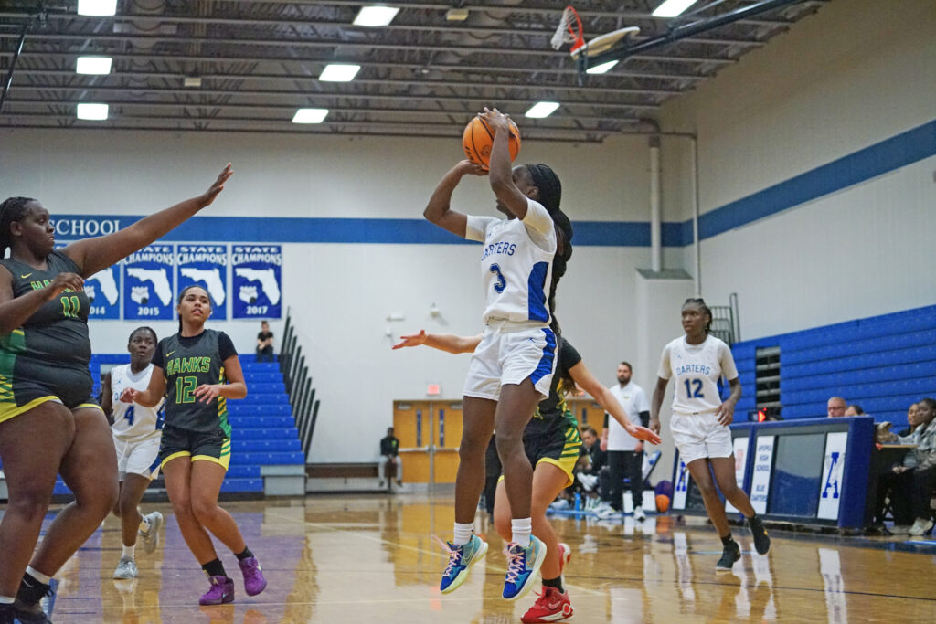 Jhenelle Francis finds open space on the court and puts a jump shot from the low post.
