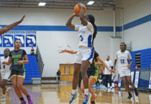Jhenelle Francis finds open space on the court and puts a jump shot from the low post.
