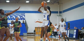 Jhenelle Francis finds open space on the court and puts a jump shot from the low post.