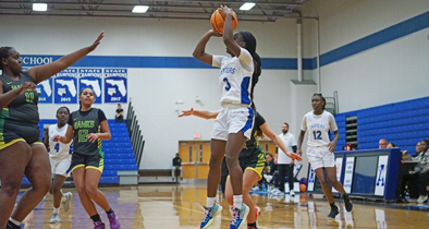 Jhenelle Francis finds open space on the court and puts a jump shot from the low post.