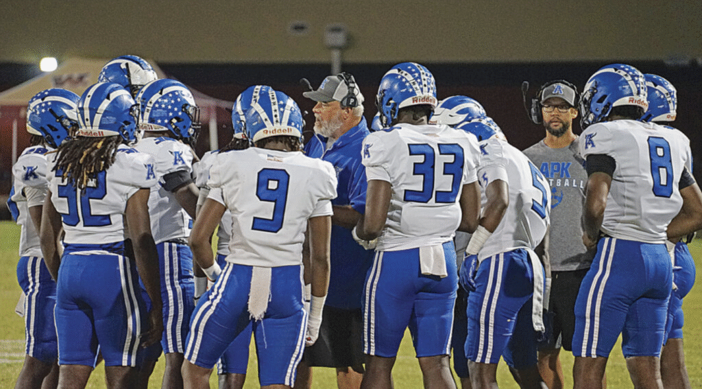 Former Apopka head coach Jeff Rolson talks to his players.