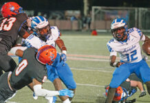 Tyson Davison uses his speed and agility to maneuver past multiple West Orange defenders.