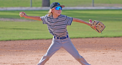 A member of Apopka Little League’s Majors All-Star team puts everything he has into a throw to first base.