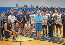 The Apopka Fire and Police Departments stand together after the third Dreams of Joy charity basketball game on Friday, May 30. Apopka's Fire Department took home the win 84-43.