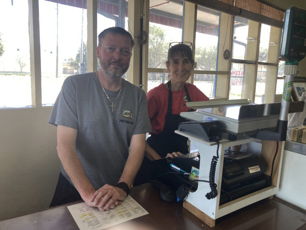 Andy Ray and Debbie Martin at the cash register