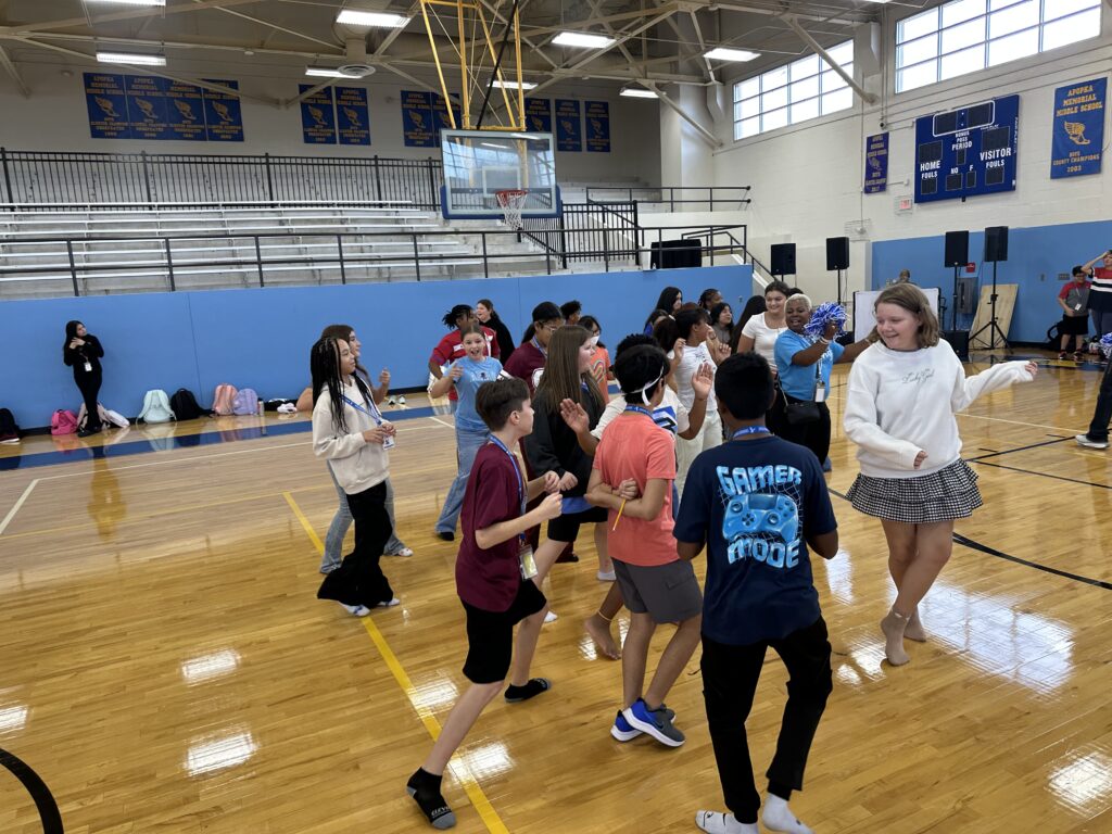 Students dance at the celebration. 