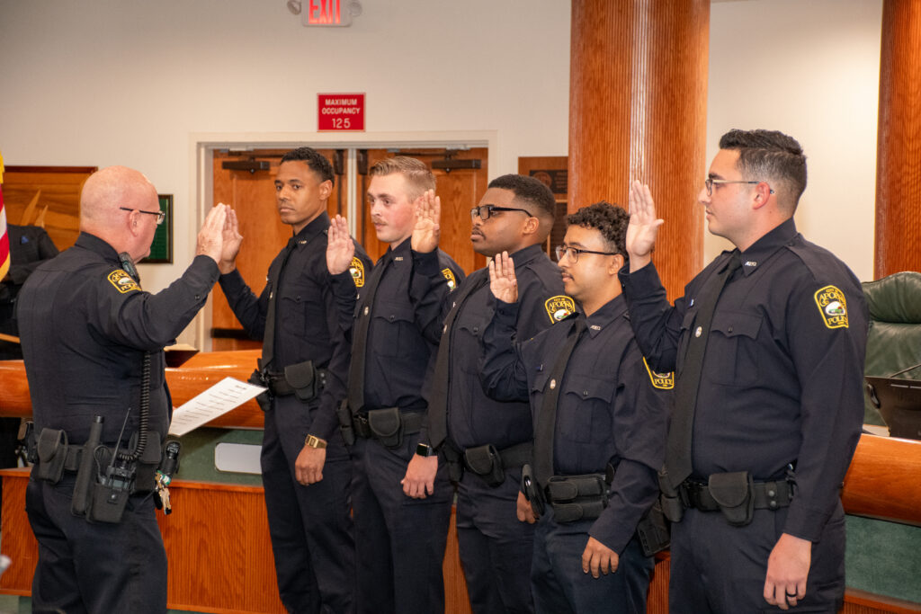 Apopka Police Chief Michael McKinley swears in (L to R) Officer Bryan Lyle, Officer Grant Collins, Officer David Keitt, Officer Angel Martinez and Officer Humberto Ramirez-Vargas.