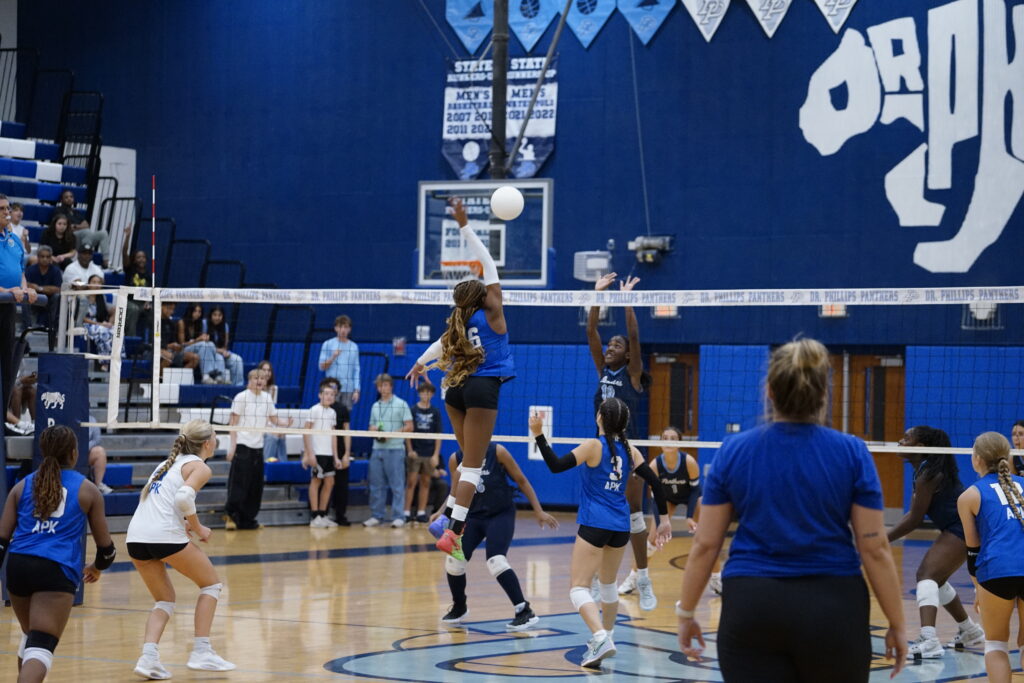 Senior Daylen Hilliman rises up at the net for a kill.