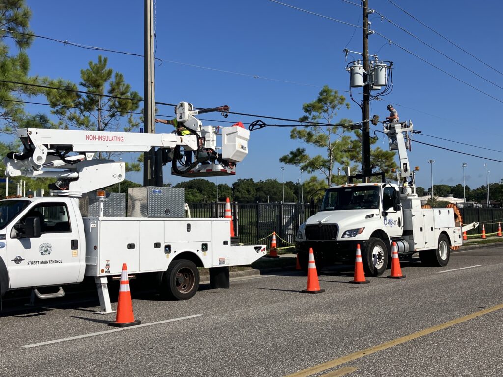 Power workers fixing the power lines and poles on Monday morning