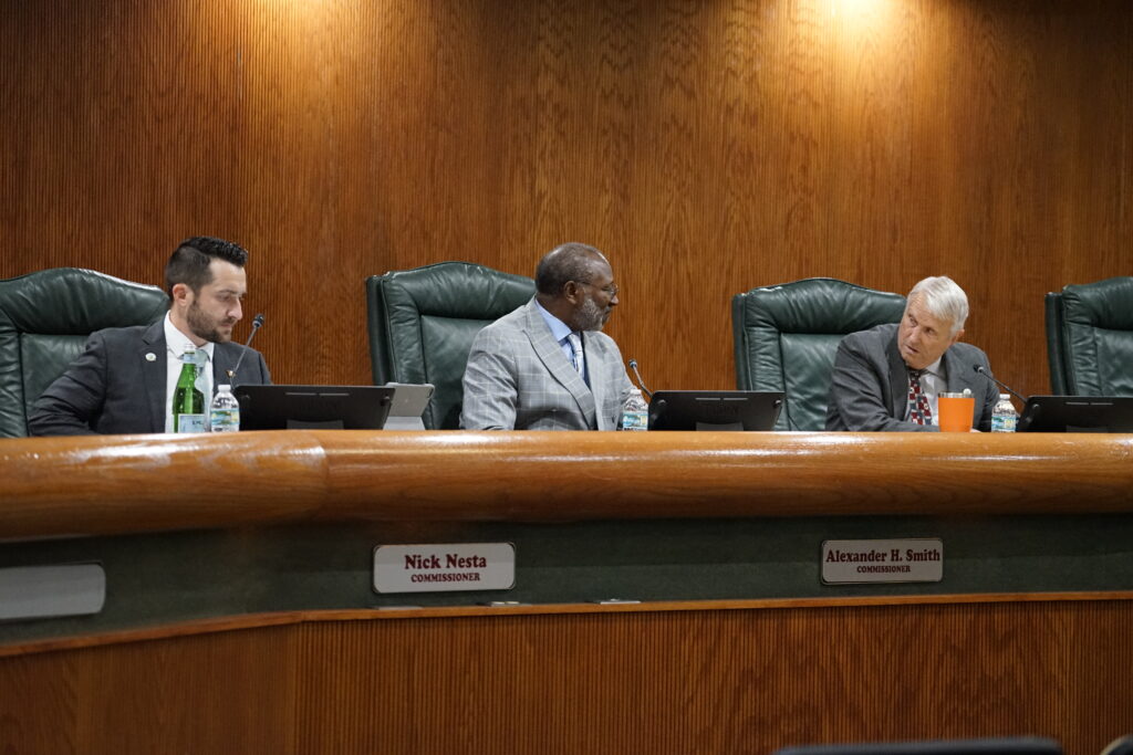 City Commissioner Nick Nesta, City Commissioner Alexander H. Smith, and Mayor Bryan Nelson (L to R) at a meeting at Apopka City Hall in July.