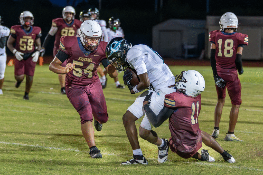 Adrian Jackson assists Rayshard Brinson on a tackle