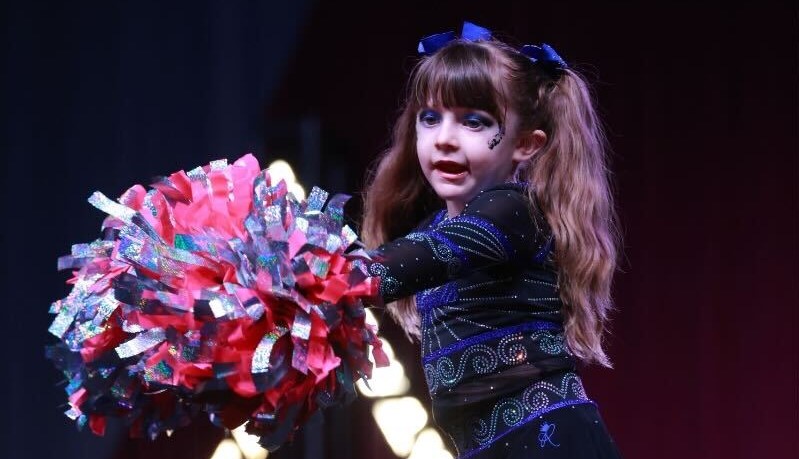 River Farmer cheers in a Tiny Tiaras competition.