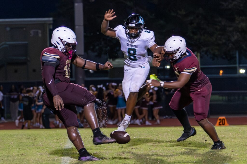 Ryder Flynn leaps for a blocked punt