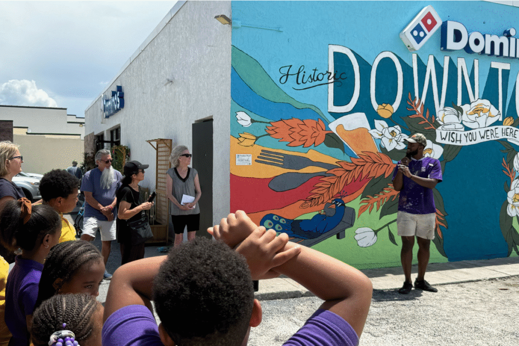 Ridge Bonnick speaks at the Downtown Mural reveal event.