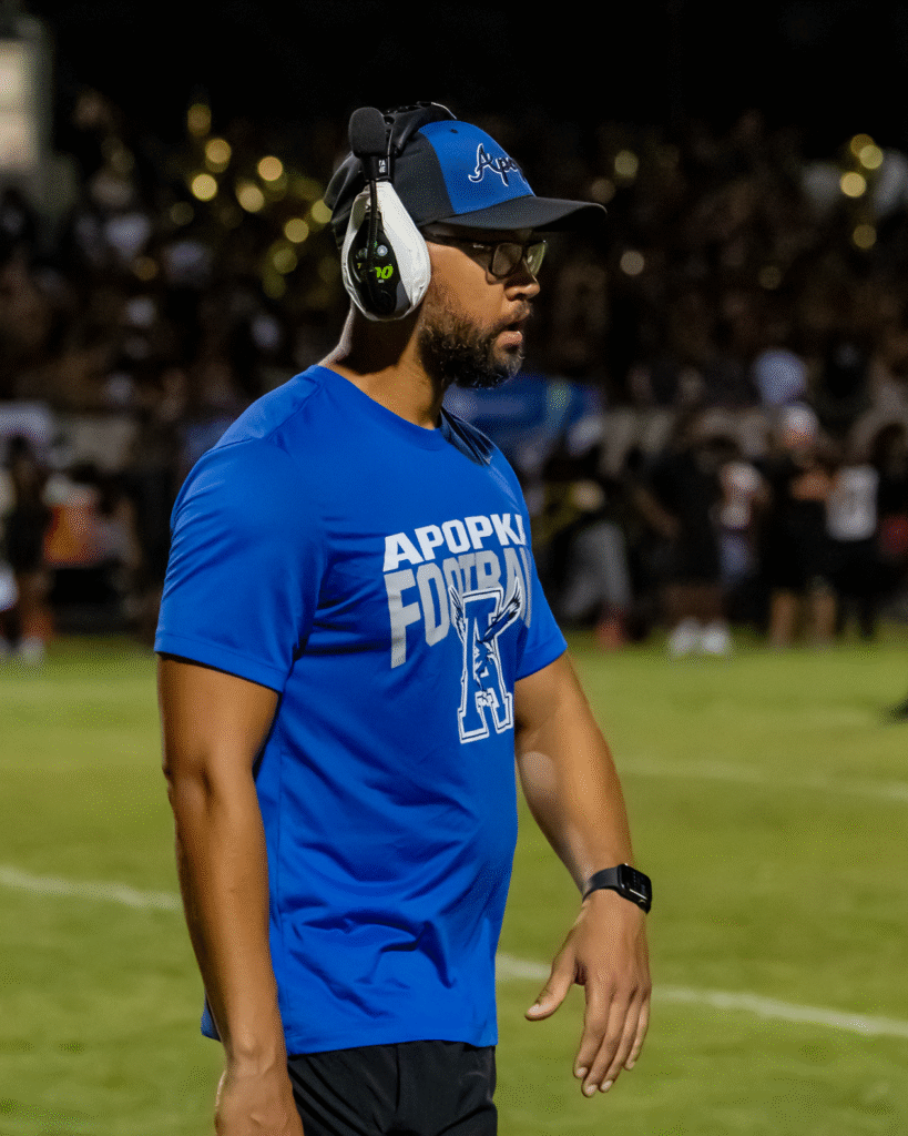 Coach Marcus Neeson on the sideline.
