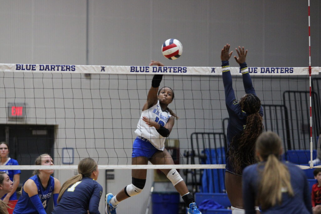 Marie Hughes rises at the net for a spike