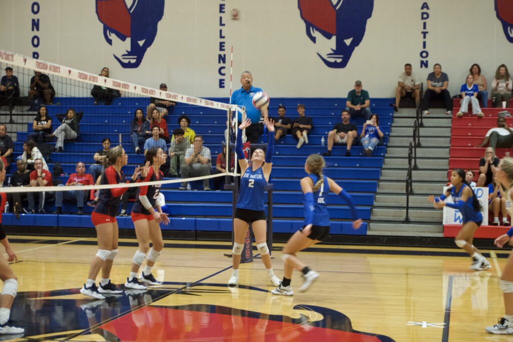 Taylor Cain sets Madeline Sherrer for a kill.