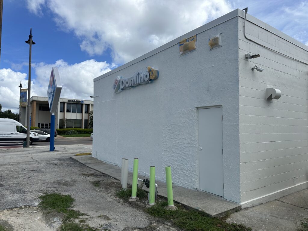 The Downtown Mural has been removed from the western wall of Domino's Pizza.