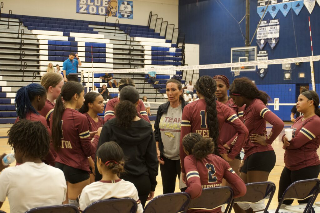 The Mustangs regroup during a timeout.