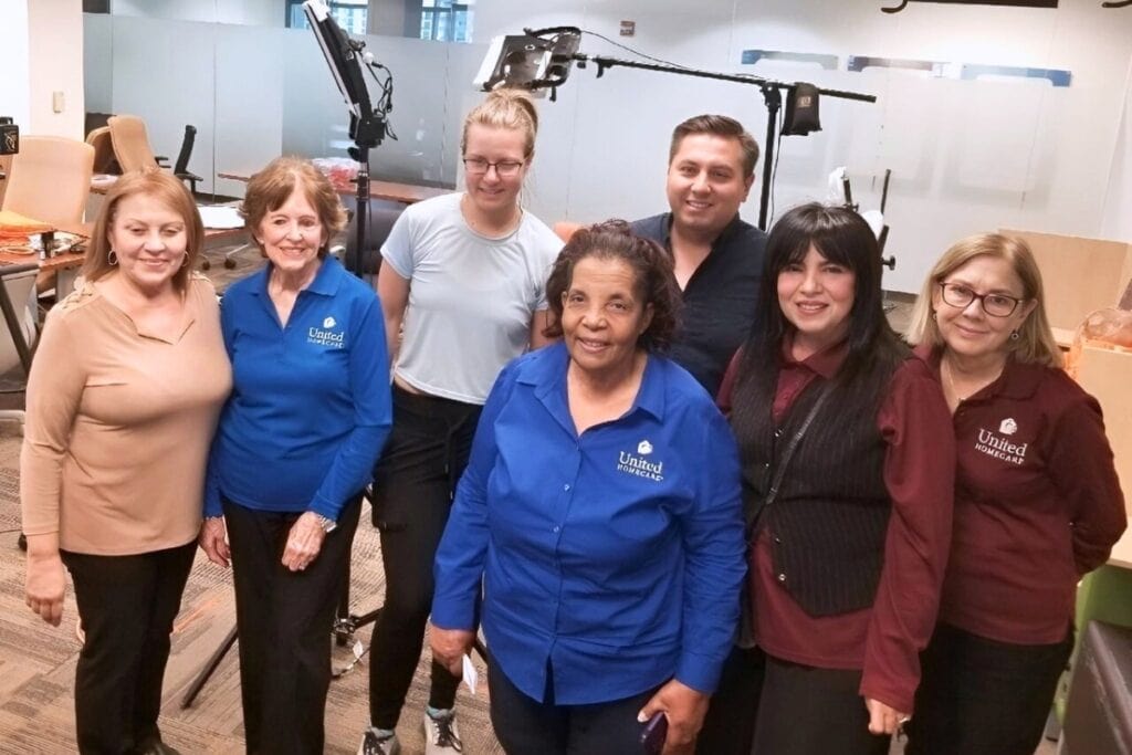 The team at United Home Care in Miami. Dr. Janette Campbell (center), with her supervisor, Alina Palenzuela, to her right, other members of the Home Care team.
