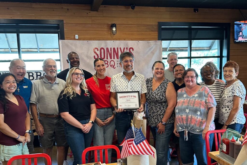 Sonny's BBQ leadership and other guests celebrate Tenison Shirai.