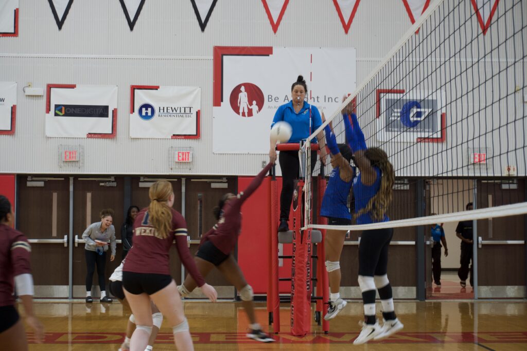 Napier and Hilliman attempt to block McFadden's tip.