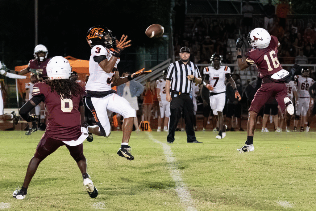 Dominique Walker hunting a hit on a Lion receiver