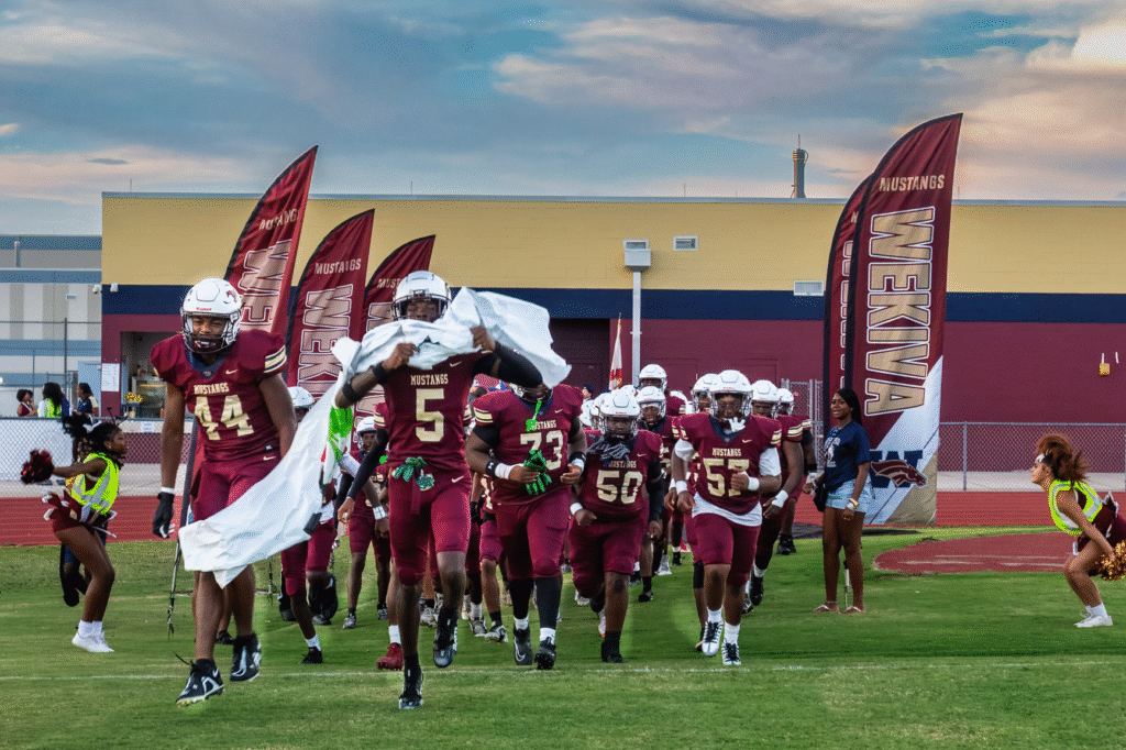 Mustangs run onto the field for Homecoming Game