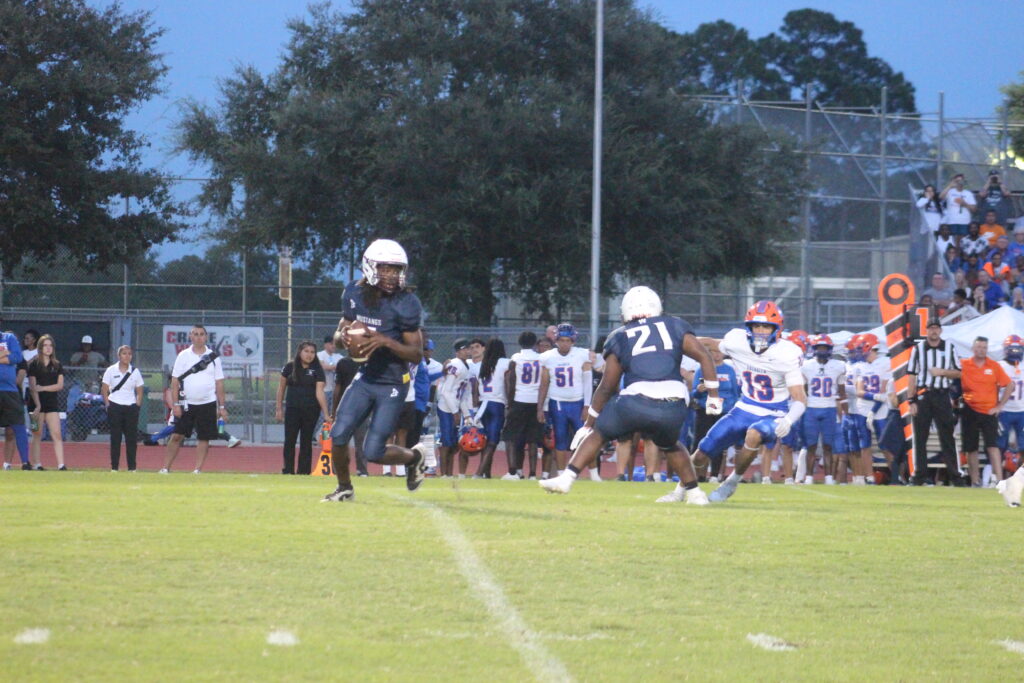 Justin Sessler drops back to pass.
