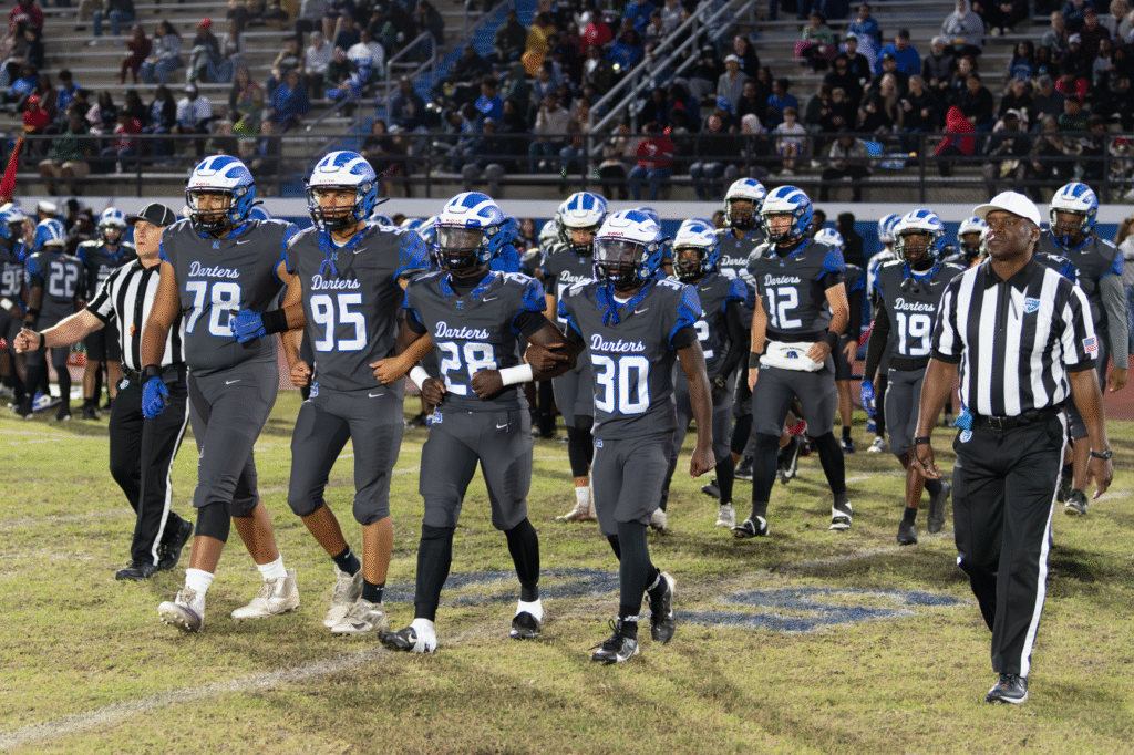 Seniors walk out for their final coin toss