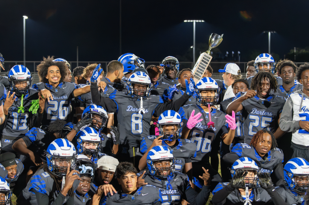Blue Darters celebrate with the Mayor's Cup trophy