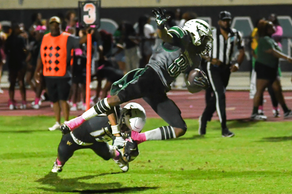 Avantae Scott trips up a Trojan