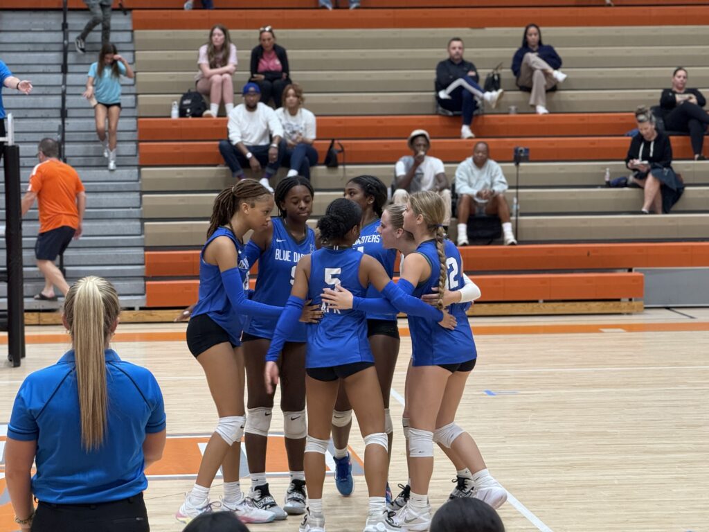 Blue Darters huddle after a point in final game