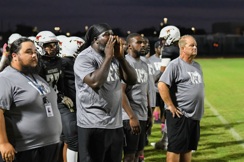 Coach Doug Gabriel and company on the Mustang sideline