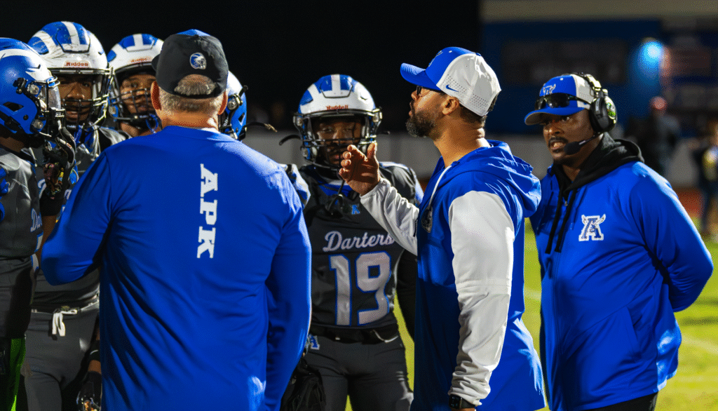 Coaches talking to the defense during a timeout