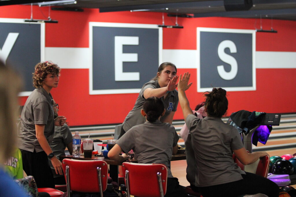 Elizabeth Marshall with high fives after a strike