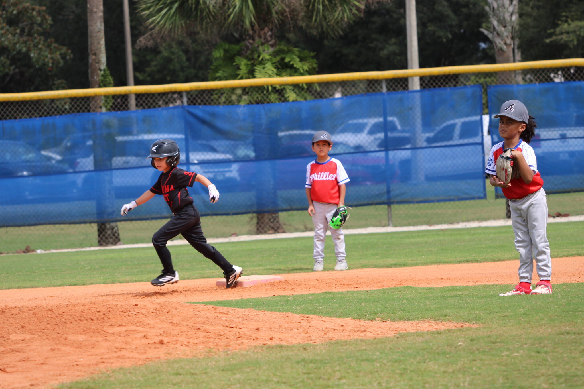 Sneaky little leaguer on the move to third base
