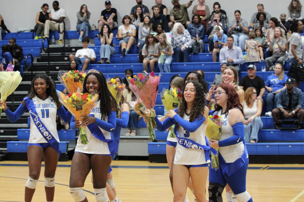 Seniors coming off the court to get ready for warmups