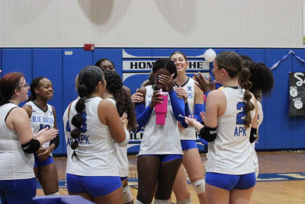 Blue Darters sing Happy Birthday to Chloe Palmer after her set finishing ace.
