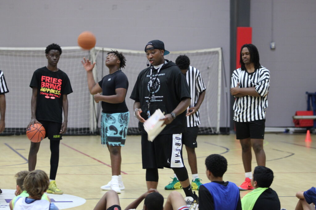 Coach Washington motivating the campers.