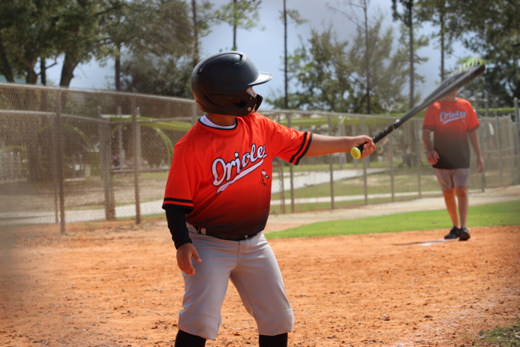 Little Leaguer preparing for a thunderous swing