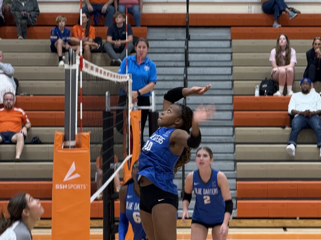Marie Hughes at the net for a spike