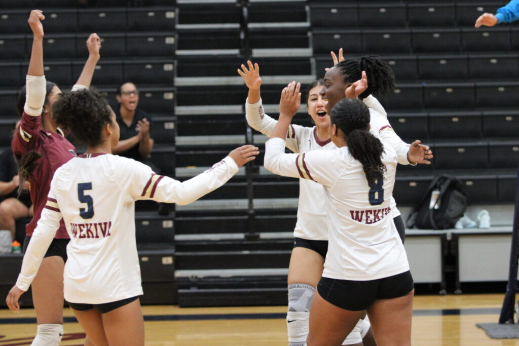 Mustangs celebrate Asheley Touze's big block.
